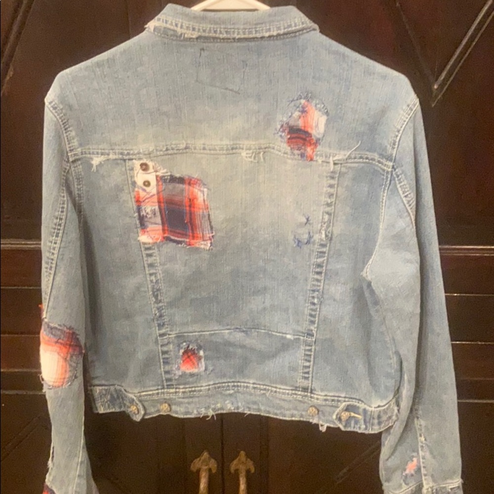 Distressed patched jean jacket